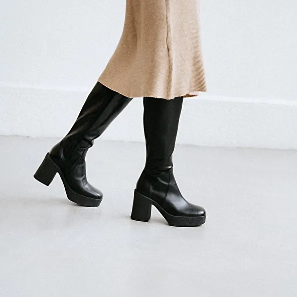 Platform boots in black aged leather